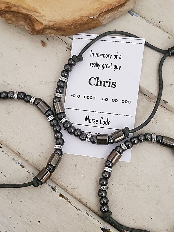 3 Morse code bracelets on trunk